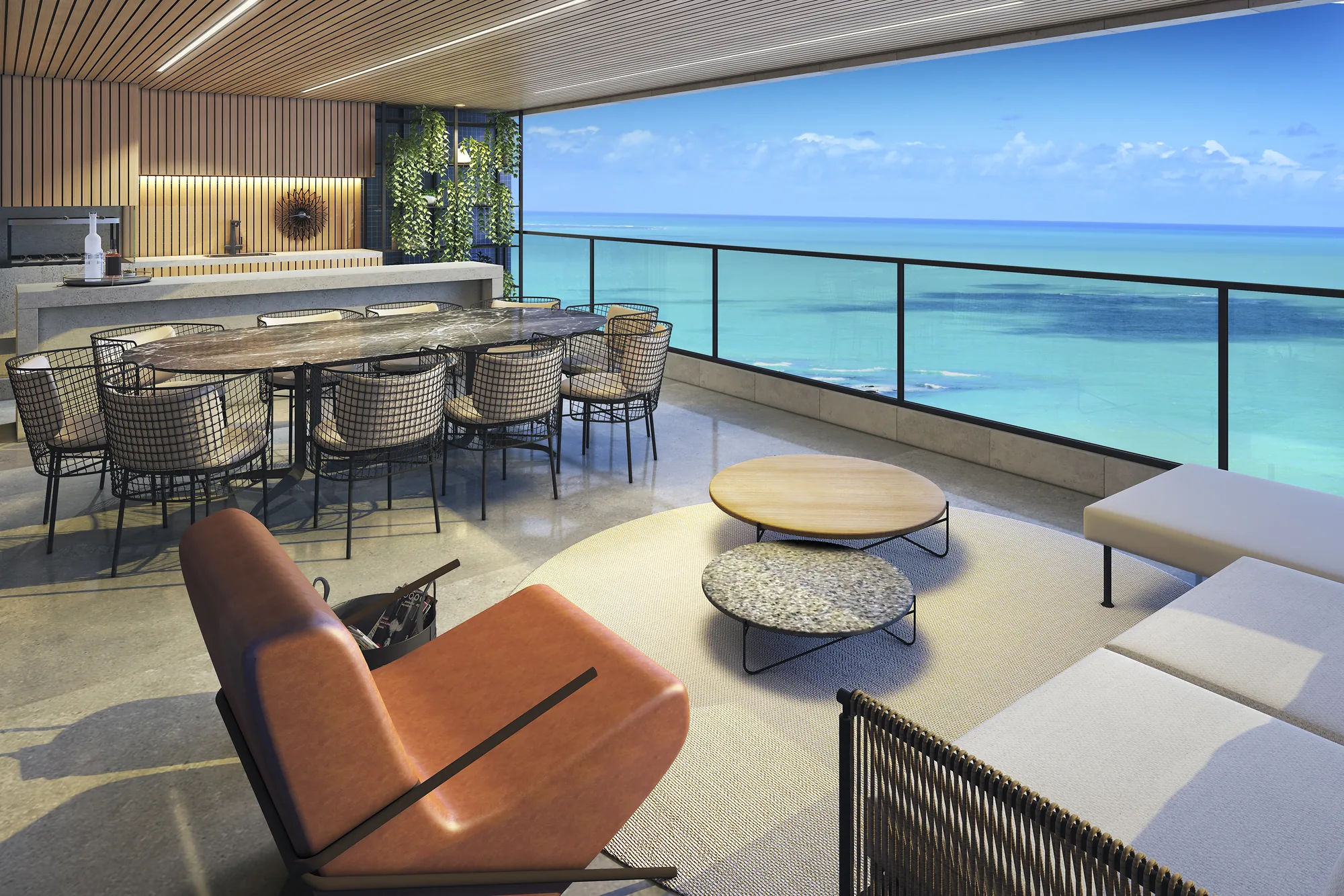 Varanda gourmet da Torre Dijon com churrasqueira, mesa de jantar e vista para o mar de Guaxuma